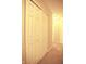 Hallway with closet featuring sliding doors and neutral carpet at 6634 Frankenberger Dr, Indianapolis, IN 46237