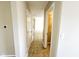 Hallway features tile flooring and leads to various rooms, including a view of the kitchen at 6634 Frankenberger Dr, Indianapolis, IN 46237
