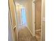 Hallway with carpet flooring leading to bedrooms at 6634 Frankenberger Dr, Indianapolis, IN 46237