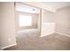 Bright living space featuring neutral walls, carpet, and an open floor plan at 6634 Frankenberger Dr, Indianapolis, IN 46237
