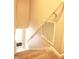 Staircase with carpet steps and white handrail at 6634 Frankenberger Dr, Indianapolis, IN 46237