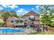 Elevated view of the backyard featuring an in-ground pool and covered patio at 676 La Placita St, Greenwood, IN 46143