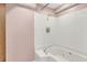 Modern bathroom featuring a white tiled whirlpool tub and tiled shower at 676 La Placita St, Greenwood, IN 46143