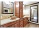 Elegant bathroom with dual sinks, granite countertops, and dark wood cabinets for functional storage at 676 La Placita St, Greenwood, IN 46143