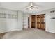 This bedroom features a ceiling fan, carpet flooring, and a large closet at 676 La Placita St, Greenwood, IN 46143