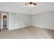 Large carpeted bedroom with ceiling fan and neutral gray paint color makes for a relaxing atmosphere at 676 La Placita St, Greenwood, IN 46143