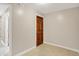 Neat and tidy room with a door and neutral paint on the walls with tiled floor at 676 La Placita St, Greenwood, IN 46143