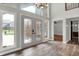 Grand foyer with high ceilings, large windows, and hardwood floors at 676 La Placita St, Greenwood, IN 46143