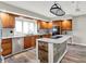 Updated kitchen featuring stainless steel appliances, granite countertops, and a center island with wood accents at 676 La Placita St, Greenwood, IN 46143