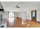 Spacious living room boasting a brick fireplace, hardwood floors, and natural lighting at 676 La Placita St, Greenwood, IN 46143