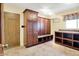 Mudroom with wood cabinets and tiled floor, providing ample storage and functionality at 676 La Placita St, Greenwood, IN 46143