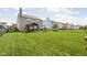 Expansive green backyard showing the home's outdoor covered patio at 6842 Viola Ct, Indianapolis, IN 46237