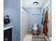 Bright bathroom showcases a stylish shower curtain, and a blue paint color at 6842 Viola Ct, Indianapolis, IN 46237