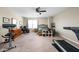 Bedroom area features a treadmill, office space, and a bed with an abundance of storage at 6842 Viola Ct, Indianapolis, IN 46237