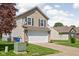 Charming home exterior featuring a two-car garage and well-kept front yard at 6842 Viola Ct, Indianapolis, IN 46237