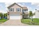 Charming two-story home featuring a two-car garage and a well-manicured front lawn in a suburban neighborhood at 6842 Viola Ct, Indianapolis, IN 46237