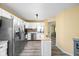 Modern kitchen with stainless steel appliances, white cabinets, and an open layout, perfect for cooking and entertaining at 6842 Viola Ct, Indianapolis, IN 46237