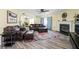 Spacious living room featuring a fireplace, leather furniture, and a colorful rug, perfect for relaxation and entertainment at 6842 Viola Ct, Indianapolis, IN 46237
