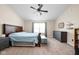 Spacious main bedroom boasts a ceiling fan, large window, and en-suite bathroom at 6842 Viola Ct, Indianapolis, IN 46237