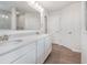 Bathroom featuring double sinks and a large mirror at 6871 Seabiscuit Rd, Whitestown, IN 46075