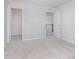 Well-lit bedroom with access to walk-in closet and a hallway, offering versatile living space at 6871 Seabiscuit Rd, Whitestown, IN 46075