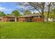 Lush green backyard showcasing the exterior with an attached garage at 70 Casco Dr, Avon, IN 46123