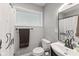 Neutral bathroom with white shower curtain and modern black fixtures at 70 Casco Dr, Avon, IN 46123