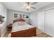 Cozy bedroom with white walls, wood furniture, and a ceiling fan at 70 Casco Dr, Avon, IN 46123