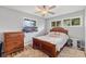 Cozy bedroom featuring wood furniture, a ceiling fan, and natural lighting at 70 Casco Dr, Avon, IN 46123