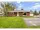 Charming single-story brick home featuring a well-maintained lawn, detached garage and long private driveway at 70 Casco Dr, Avon, IN 46123