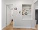 Hallway with a view into a bathroom and a built-in shelving unit at 70 Casco Dr, Avon, IN 46123