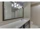 Traditional bathroom featuring vanity with large mirror, tile flooring and shower with curtain at 7053 Colita More Nw Ct, Indianapolis, IN 46254