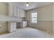 Cozy bedroom with built-in desk, drawers and upper cabinets, perfect for a home office at 7053 Colita More Nw Ct, Indianapolis, IN 46254