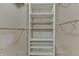 Organized walk-in closet with open shelving and hanging rods for efficient storage at 7053 Colita More Nw Ct, Indianapolis, IN 46254