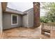 Wooden deck with outdoor seating and a brick chimney overlooking backyard at 7053 Colita More Nw Ct, Indianapolis, IN 46254