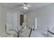 Bright dining area features a glass table, seating, and a white dresser at 7053 Colita More Nw Ct, Indianapolis, IN 46254