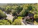 Aerial view displays several houses nestled among lush trees in a quiet suburban neighborhood at 7126 Nile Ridge Ct, Indianapolis, IN 46236