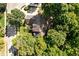 Stunning aerial view of a home nestled among mature trees in a quiet neighborhood at 7126 Nile Ridge Ct, Indianapolis, IN 46236