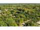 Gorgeous aerial view of a tree-filled neighborhood showcasing nature and residences at 7126 Nile Ridge Ct, Indianapolis, IN 46236