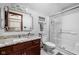 Bathroom featuring granite countertop, cherry cabinets, and a glass enclosed shower at 7126 Nile Ridge Ct, Indianapolis, IN 46236