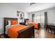 Bedroom featuring two beds, a desk area, and hardwood floors at 7126 Nile Ridge Ct, Indianapolis, IN 46236