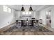 Finished basement dining area with large rug, modern lighting, and white cabinetry at 7126 Nile Ridge Ct, Indianapolis, IN 46236