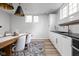 Modern dining area featuring table with wood countertop and plenty of white cabinetry at 7126 Nile Ridge Ct, Indianapolis, IN 46236