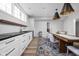 Updated dining area featuring modern lighting, lots of white cabinetry and new appliances at 7126 Nile Ridge Ct, Indianapolis, IN 46236