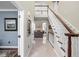 Spacious foyer with tile flooring, a staircase, and views into the living room at 7126 Nile Ridge Ct, Indianapolis, IN 46236