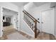 Bright hallway with wooden flooring and a staircase leading to the upper level at 7126 Nile Ridge Ct, Indianapolis, IN 46236