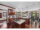 Gourmet kitchen features granite countertops, custom cabinetry, and a center island with cooktop at 7126 Nile Ridge Ct, Indianapolis, IN 46236