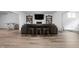 Open living room area with hardwood floors, cozy seating and decorative fireplace feature at 7126 Nile Ridge Ct, Indianapolis, IN 46236
