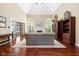 Vaulted living room with hardwood floors, fireplace, and french doors to back at 7126 Nile Ridge Ct, Indianapolis, IN 46236