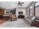 Open concept living space that includes a living room, kitchen, and dining area with modern decor and finishes at 7126 Nile Ridge Ct, Indianapolis, IN 46236